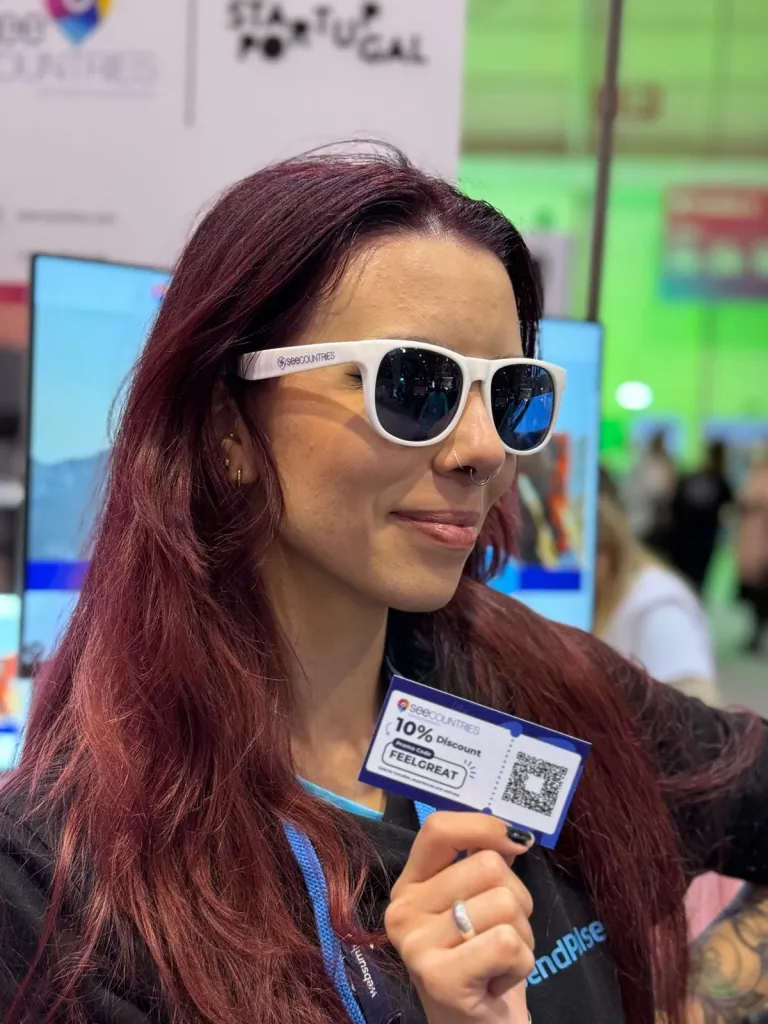 SEE Countries team member with branded glasses and a business card at Web Summit 2024